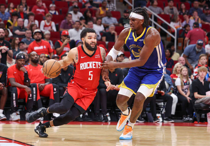 Houston Rockets guard Fred VanVleet (5) drives past Golden State Warriors center Kevon Looney (5)